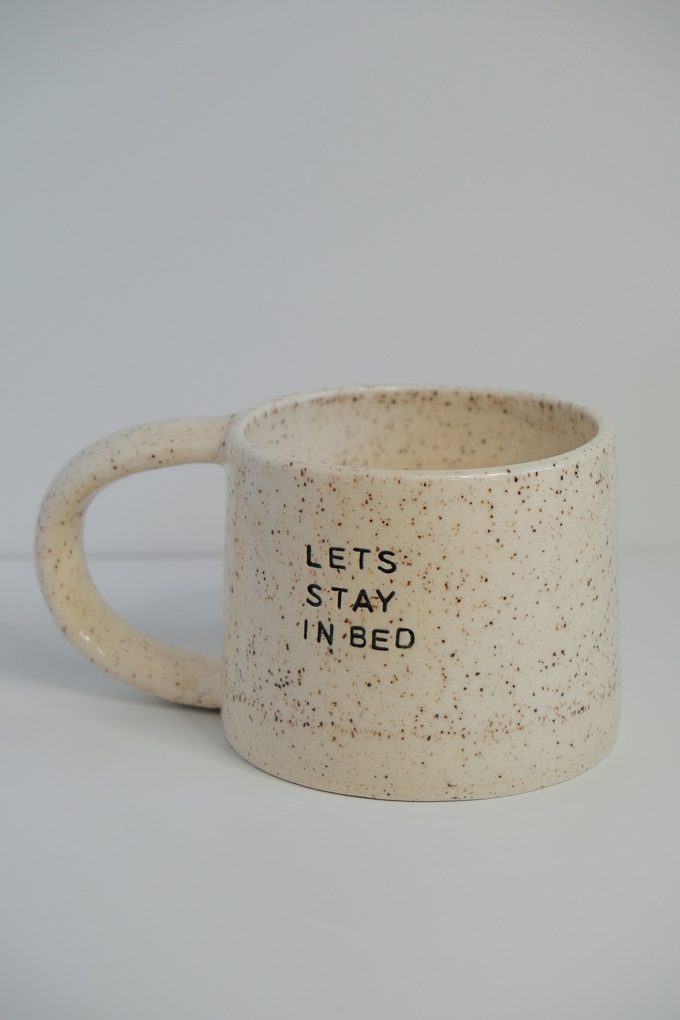 'let's stay in bed' mini mug